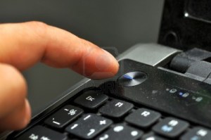 12886541-finger-pressing-power-button-on-laptop-keyboard